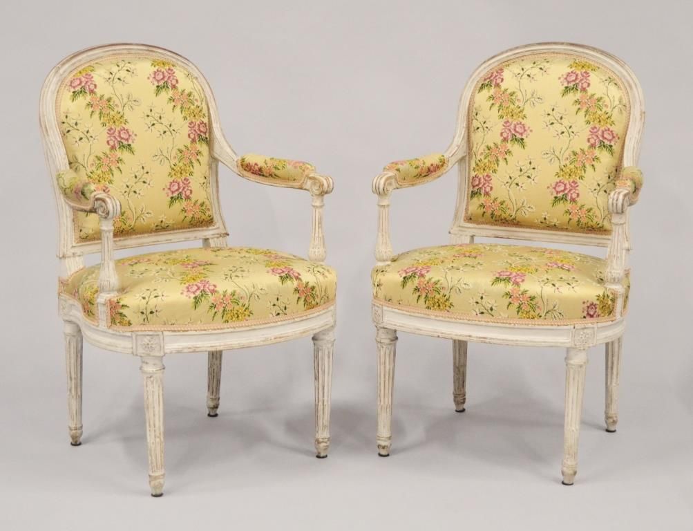 Null Pair of straight-backed armchairs in moulded wood, reupholstered in cream. &hellip;