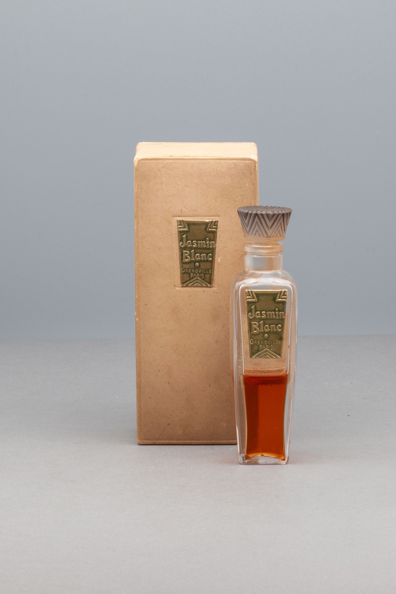 GRENOVILLE "JASMIN BLANC" 玻璃瓶，金色标签。风格化的塞子。在其标题的盒子里。高12厘米 - 盒子尺寸14x5,7厘米