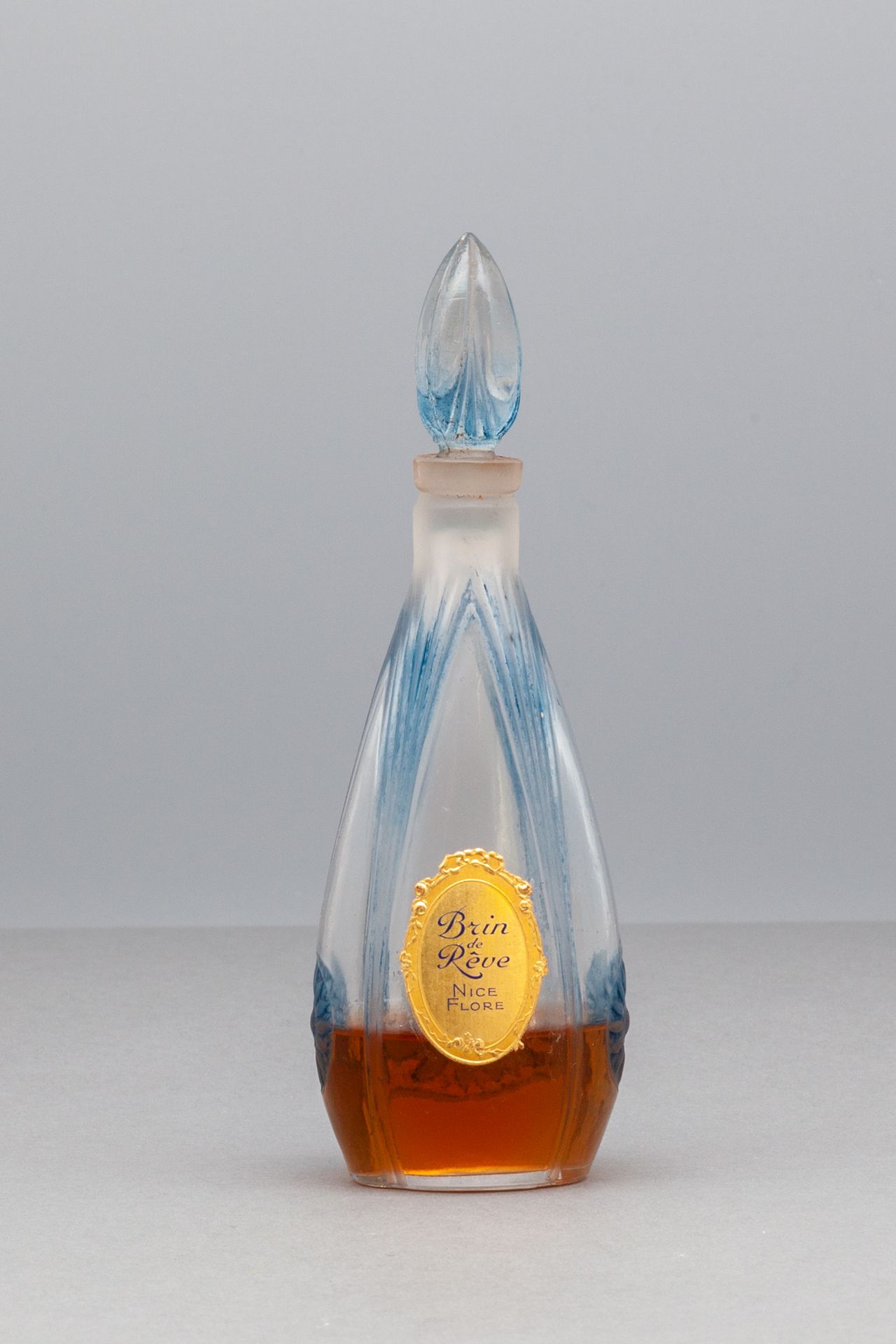 NICE FLORE "BRIN DE RÊVE" Tropfenförmige Glasflasche in blauer Farbe. H 14,5 cm