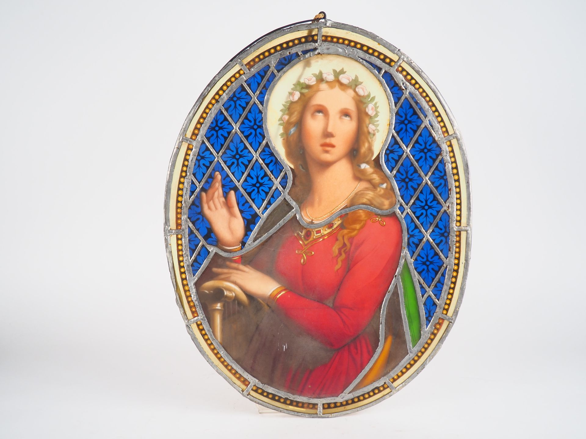 Null 19世纪的椭圆形彩色玻璃窗。

"圣女"。

尺寸：54 x 41 cm