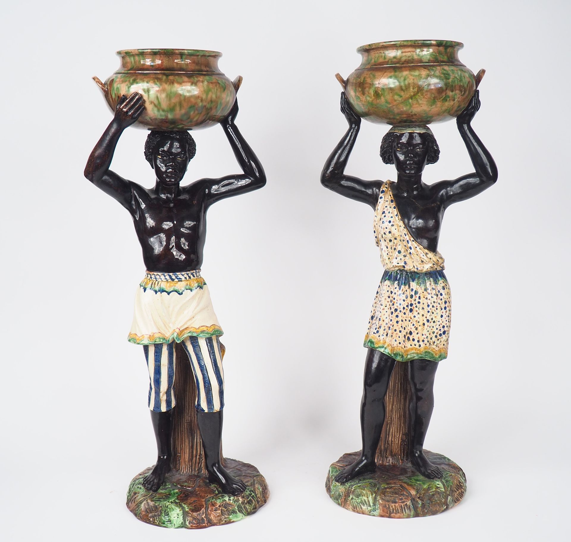 Null Pair of Napoleon III polychrome barbotine planters "Young Nubians".
H. 70 c&hellip;