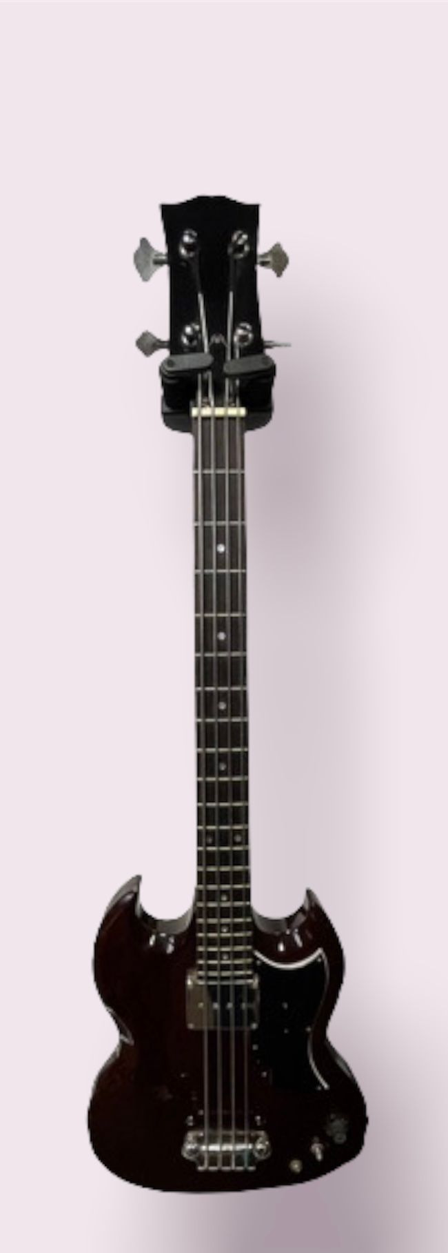 Null 电子低音吉他，SG型

经清漆处理的木材

(有少量磨损痕迹，背面有明显孔洞)

带灰色箱子（锁和铰链生锈了）