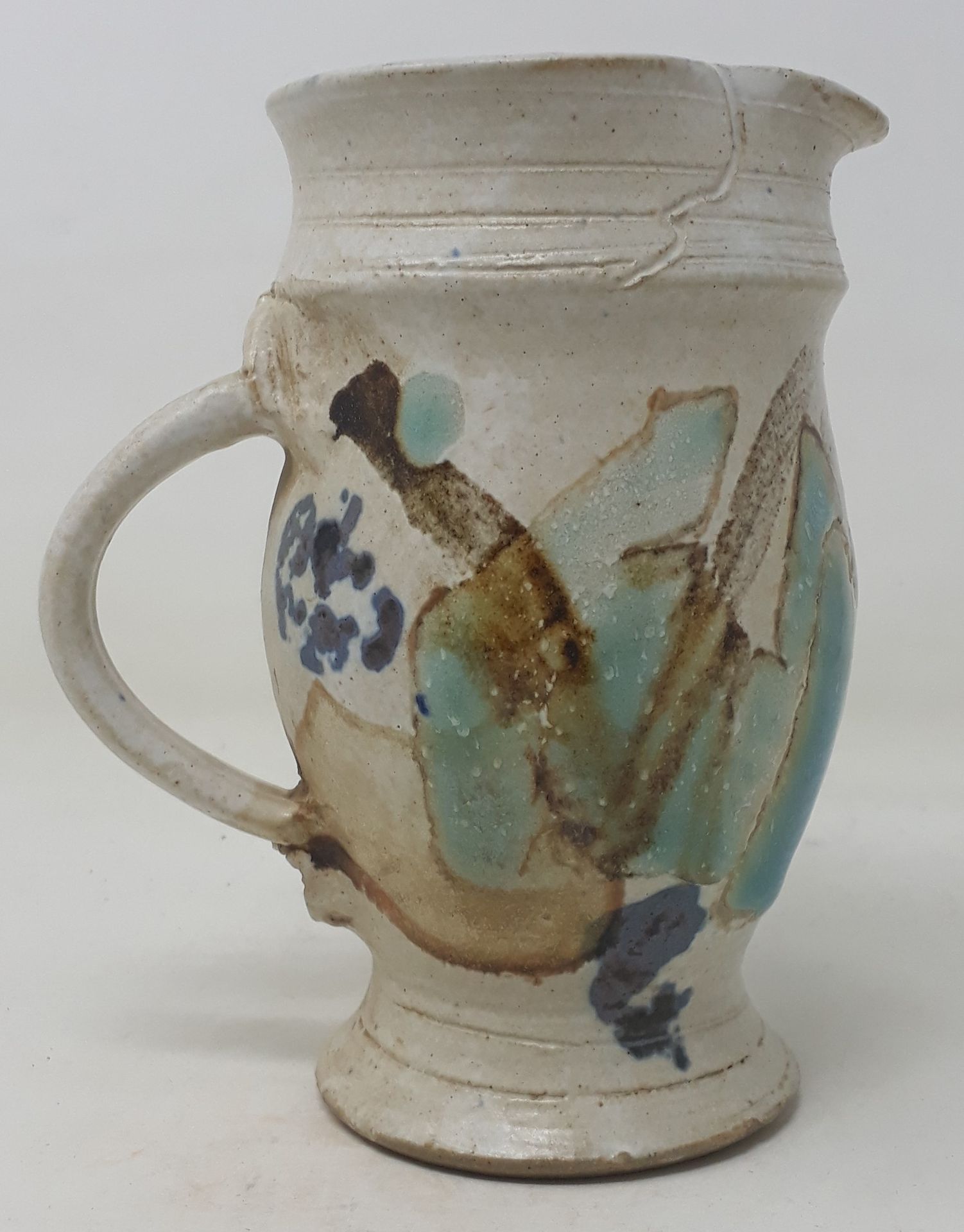 COSTES Marie 
Small stoneware pitcher with blue and brown decoration, signed 
H.&hellip;