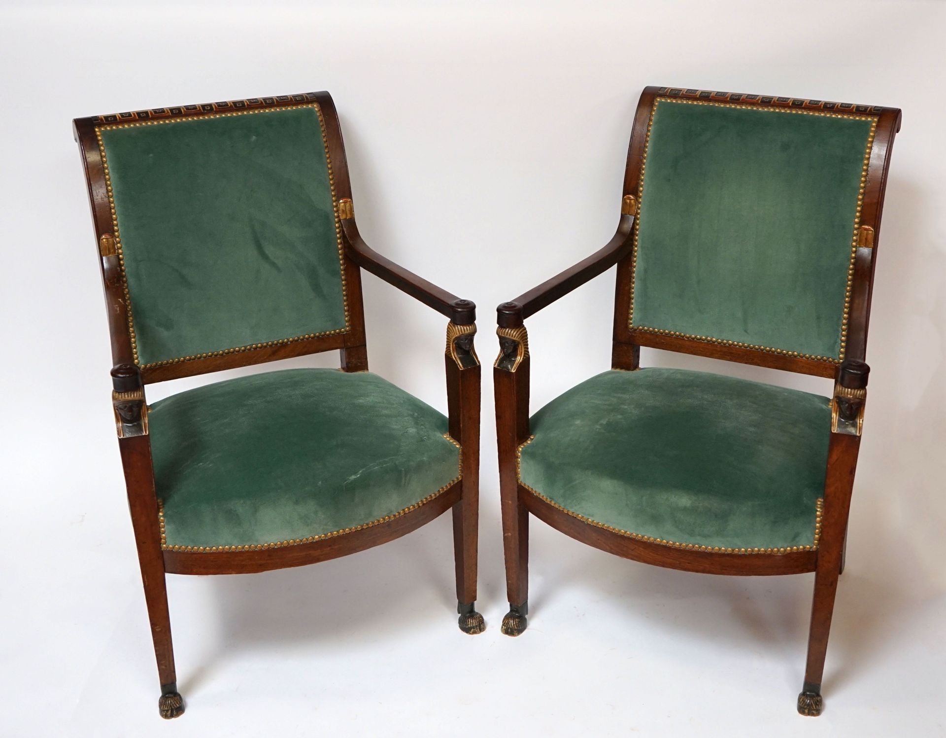 Null 
Pair of mahogany and veneered mahogany armchairs, the legs resting on drom&hellip;