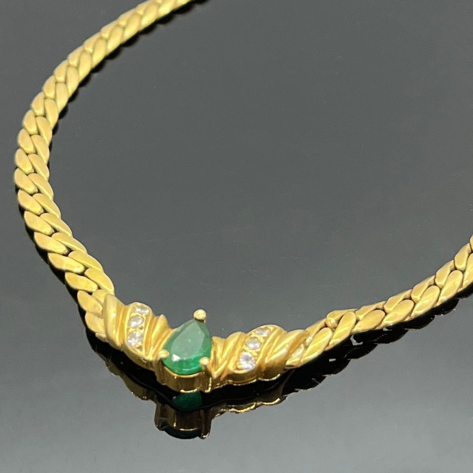 Null NECKLACE in yellow gold with a pear-cut emerald and small diamonds in the c&hellip;