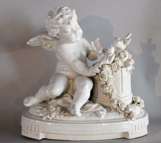 Null CAPODIMONTE. 

Small putto with birds. 

White porcelain group, after V. Me&hellip;
