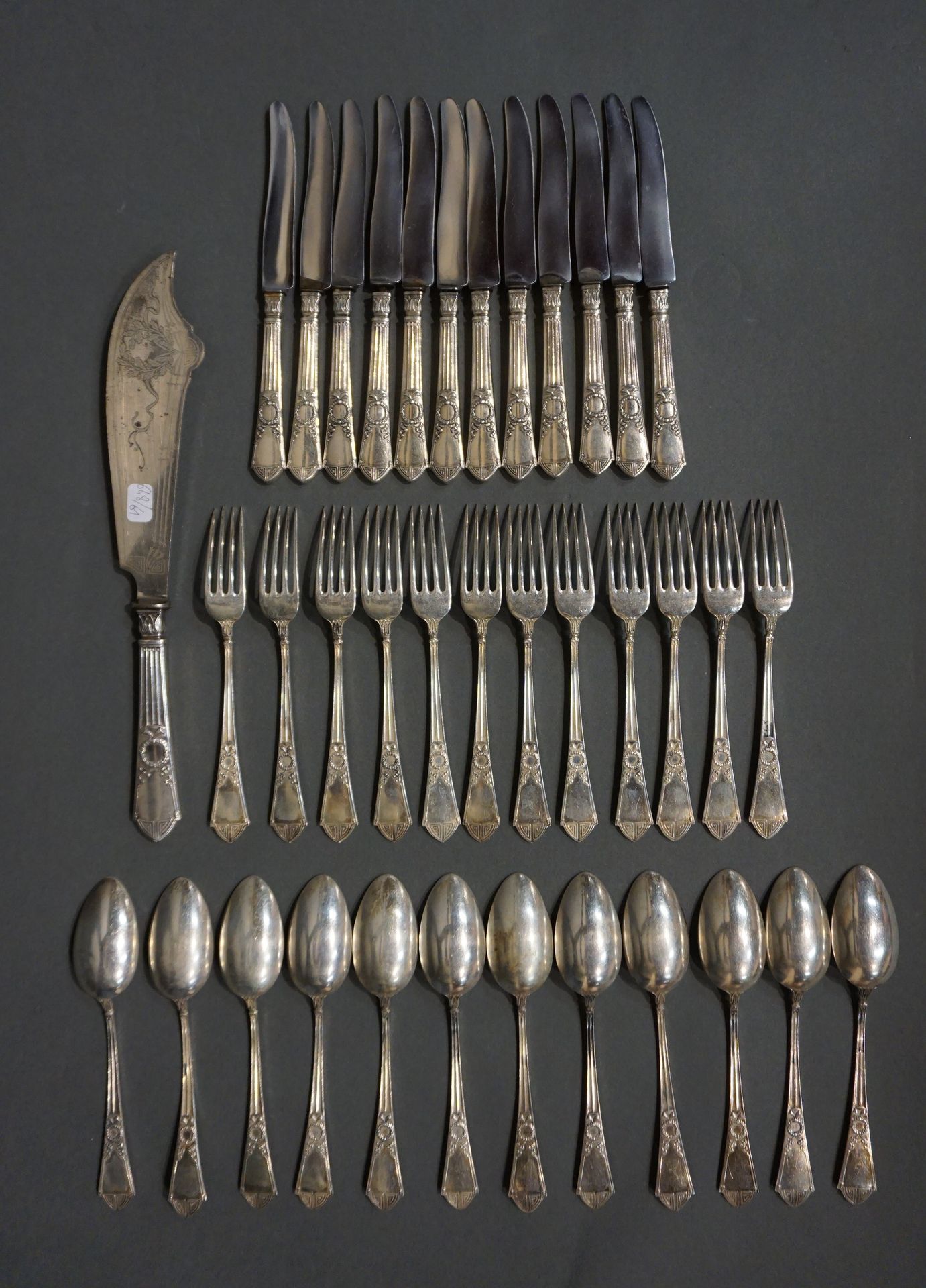 COUVERTS Twelve silver spoons and twelve silver forks with laurel wreaths (Total&hellip;