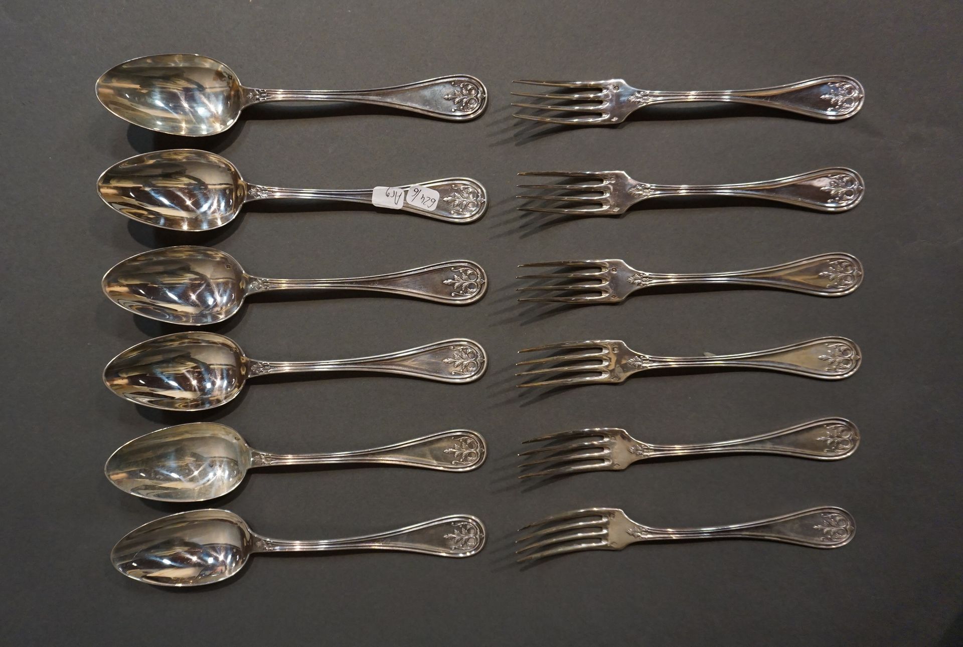 COUVERTS Six large silver spoons and six large silver forks with medallion decor&hellip;