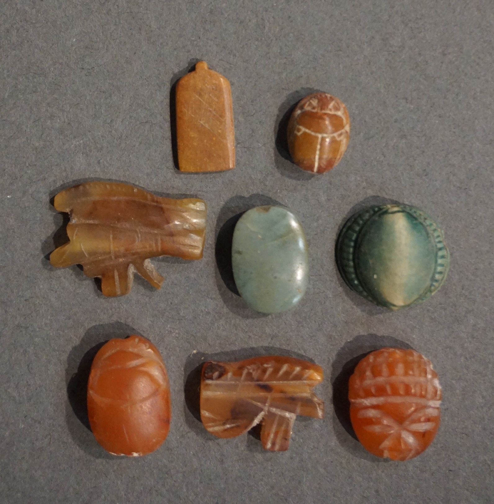 Null 
Lot including two scarabs, one in the shape of a kauri and one in the shap&hellip;