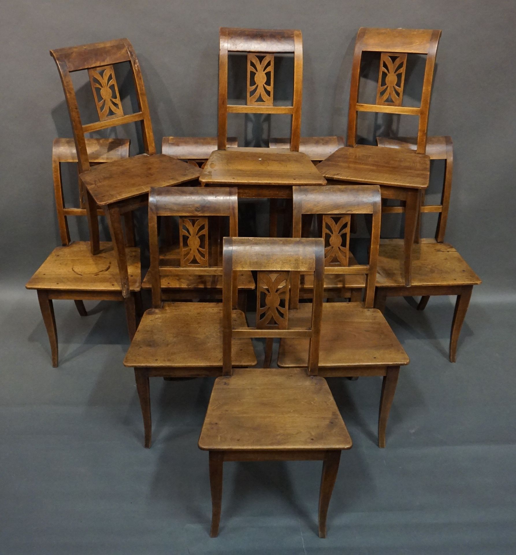 CHAISES Ten chairs in natural wood with reversed back in the Directoire style. 9&hellip;
