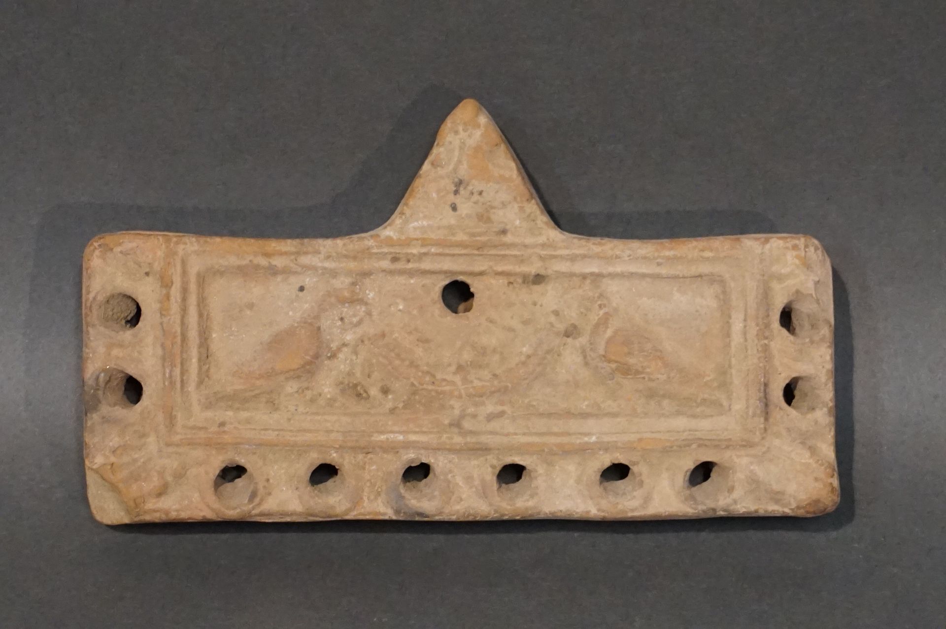 Null Rectangular oil lamp with ten spouts and a medallion representing two doves&hellip;