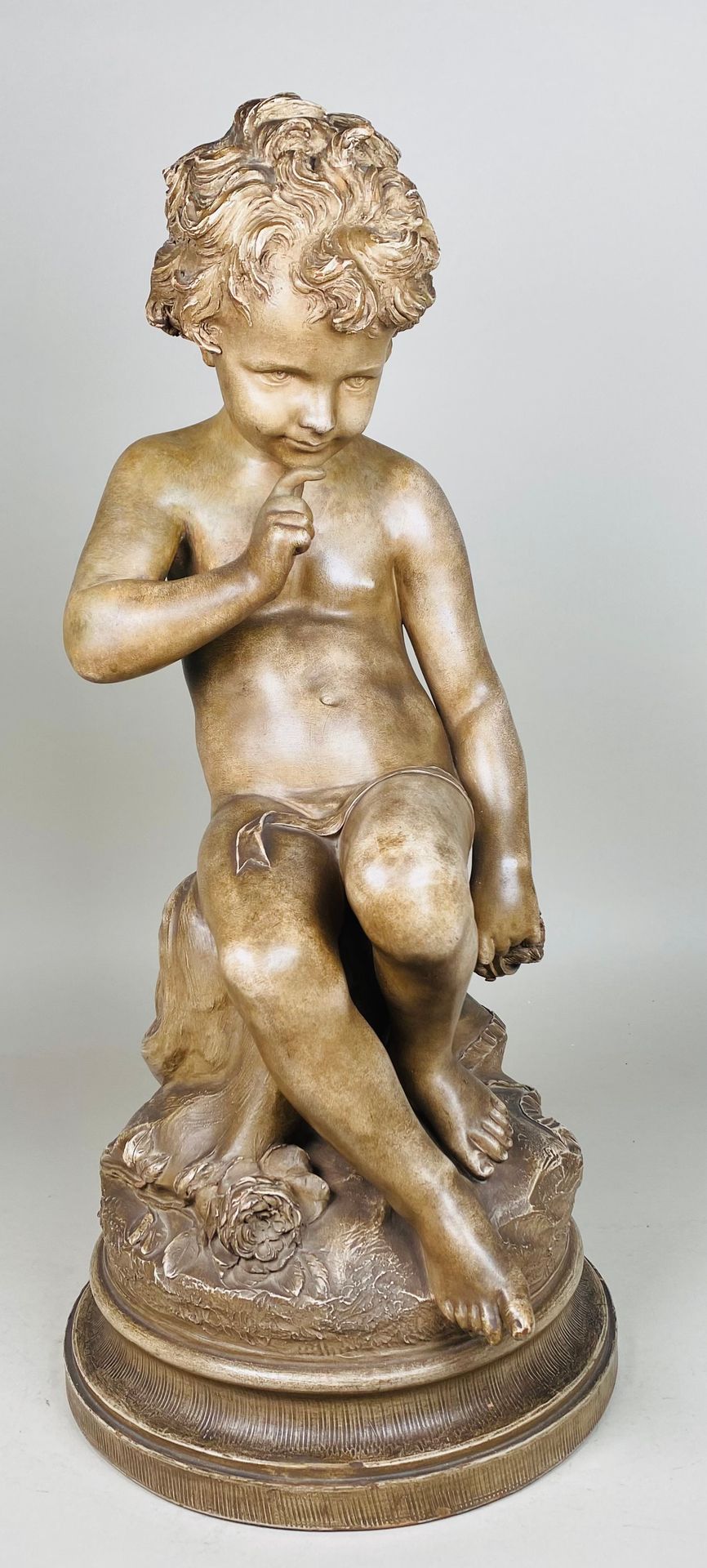 FALCONET (D'APRES) Seated putti. Patinated terracotta. Signed. Based on a model &hellip;