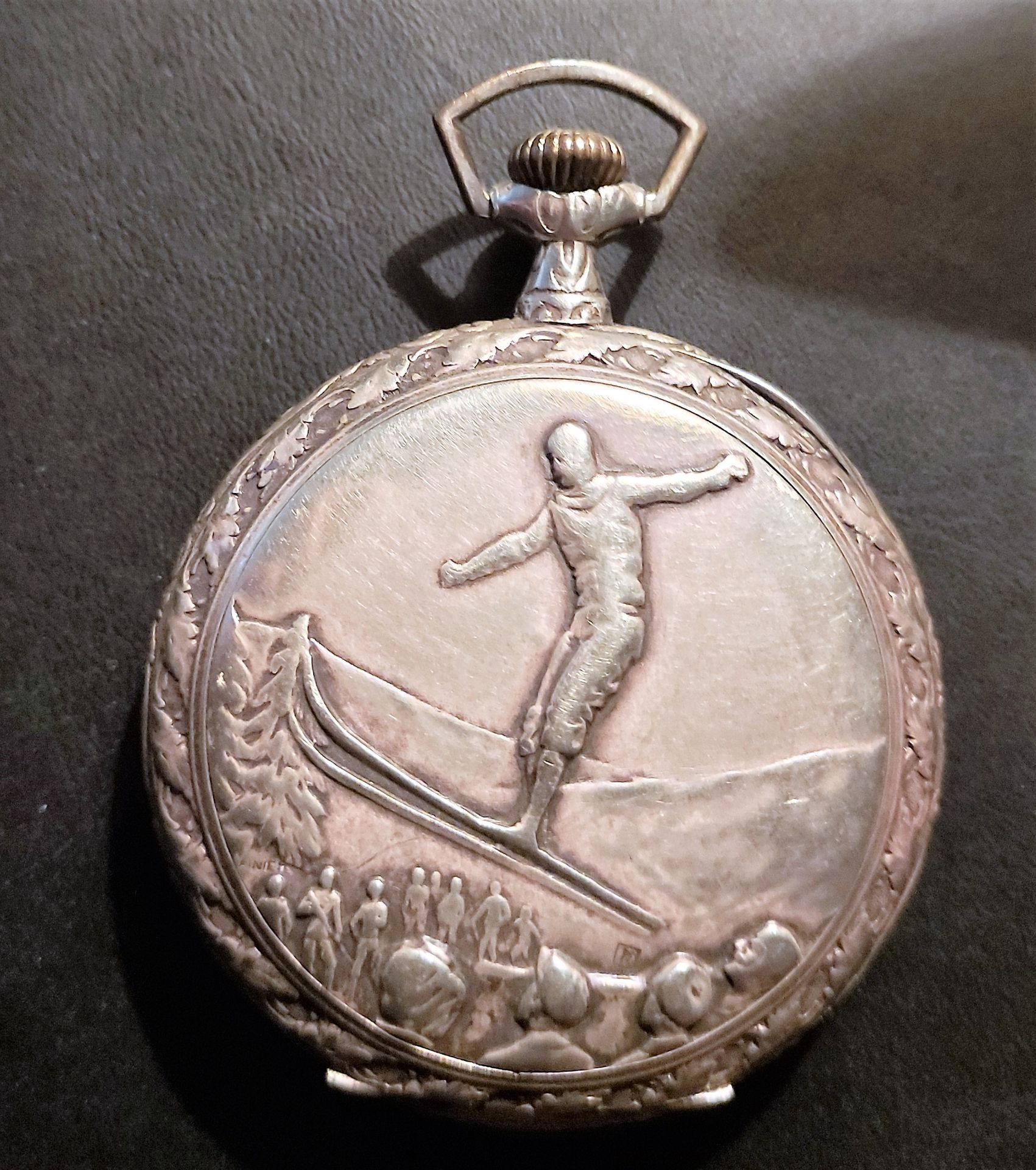 Null Pocket watch with decoration on the back: Skier at the ski jump. Circa 1910&hellip;