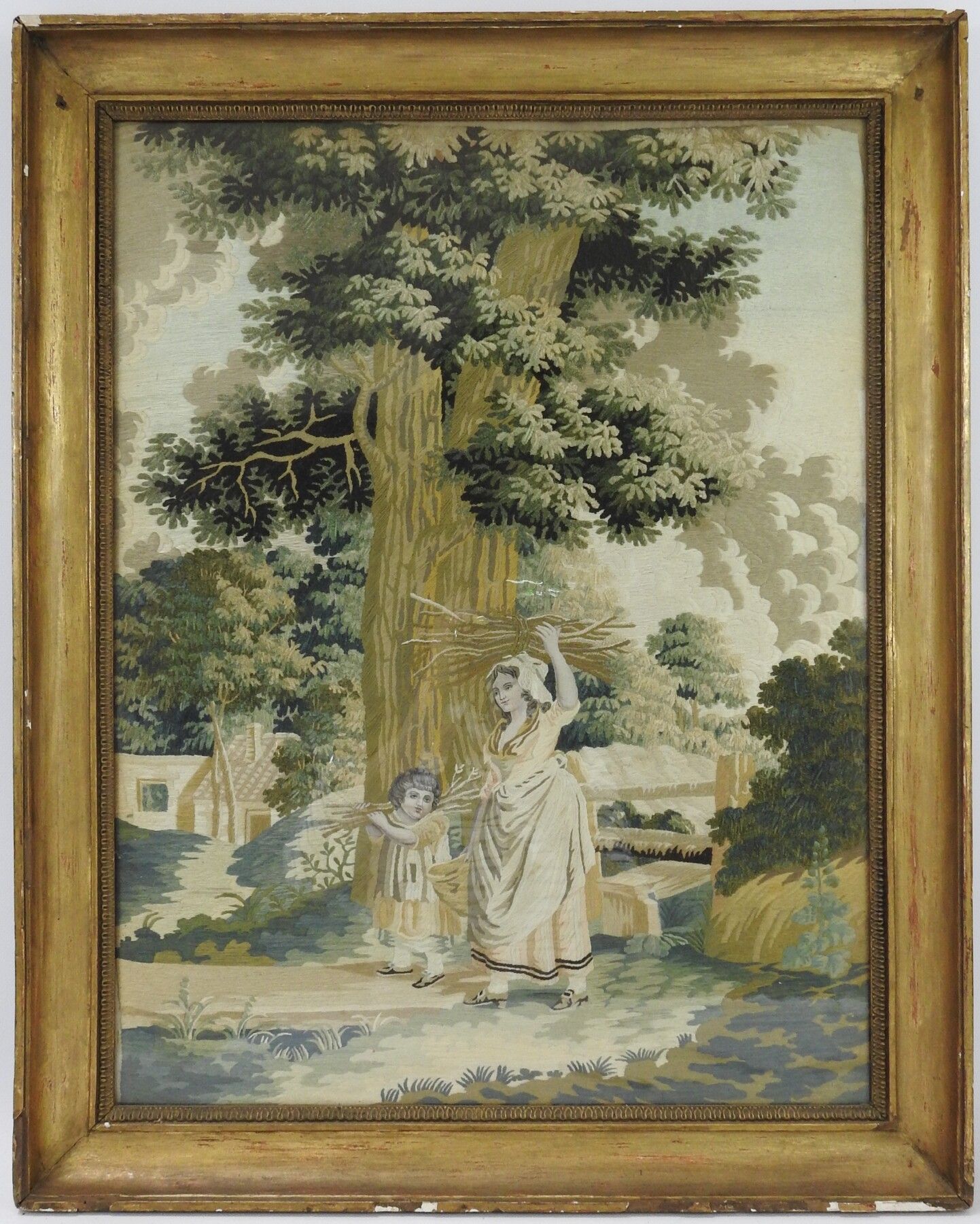 Null BRODERIE encadrée, femme et son fils portant des fagots. 63 x 47 cm.
