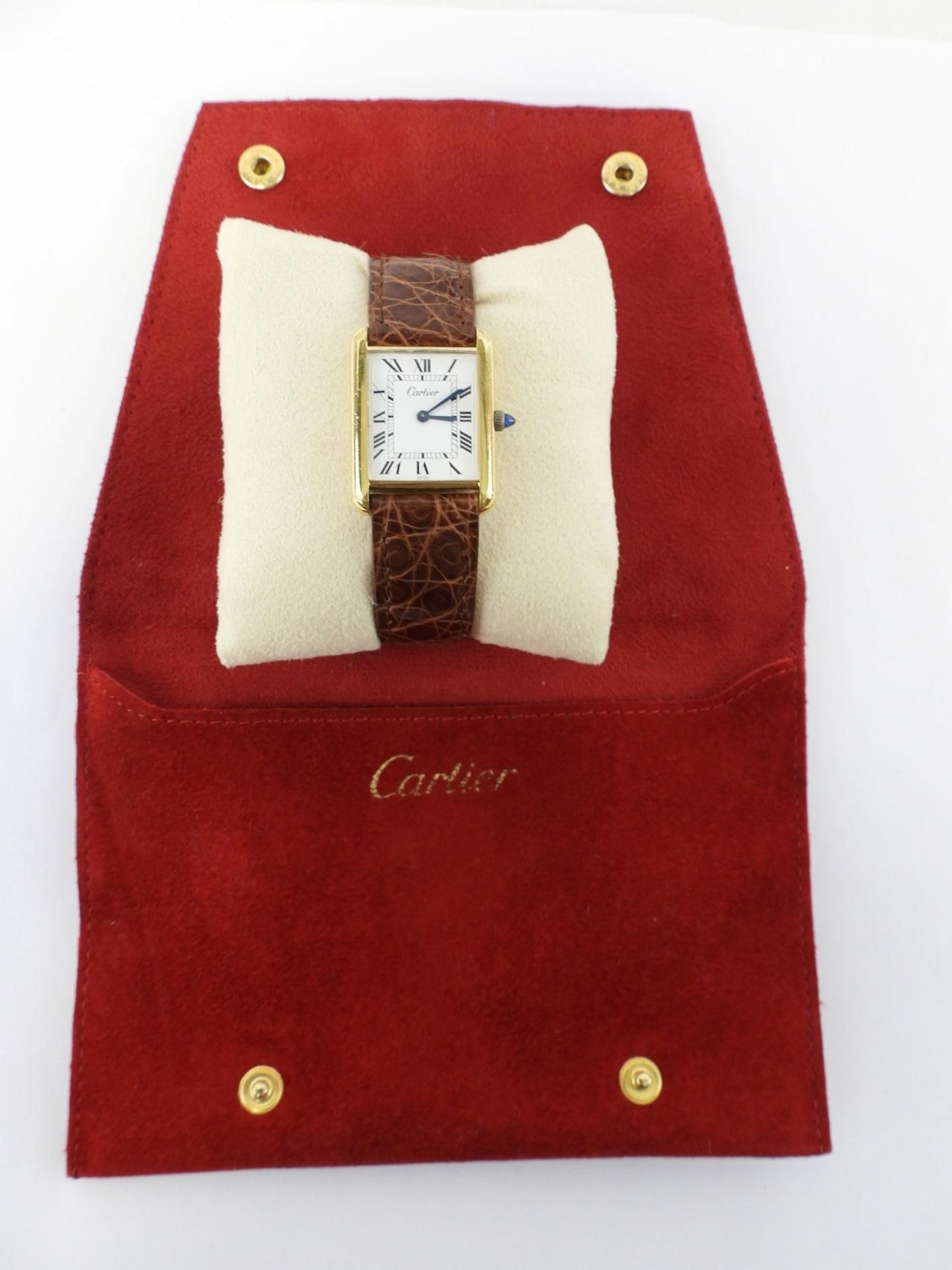 Null 
CARTIER: Must watch, gold plated, enamel dial with Arabic numerals, brown &hellip;