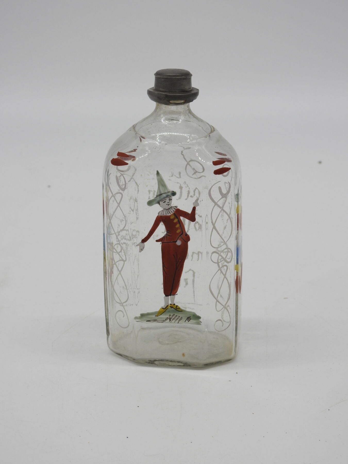 Null 德国 (?): 珐琅彩玻璃瓶，装饰着一个小丑，上面刻着 "Du allein forlit mein fein"。锡制瓶塞。17厘米