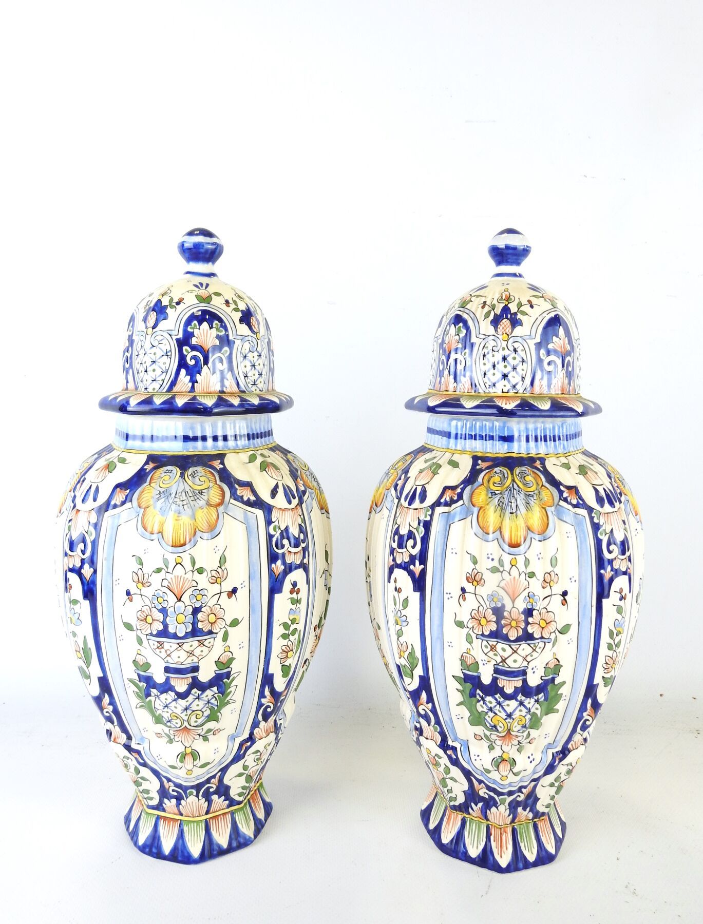 Null A PAIR OF covered earthenware vases, pan-shaped and fluted, decorated with &hellip;