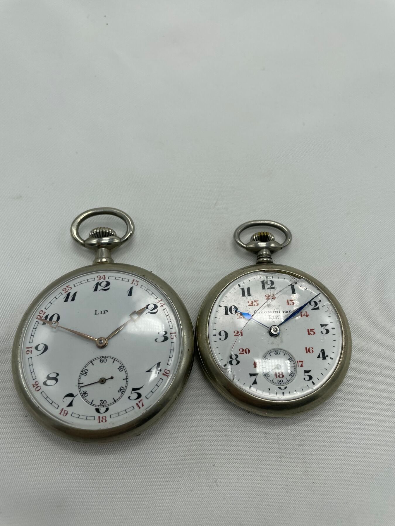 Null LIP, set of 2 metal pocket watches, mechanical movements, enameled dials. D&hellip;