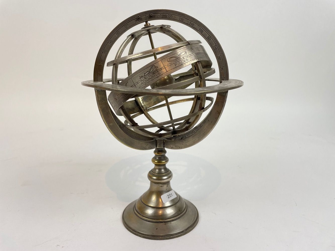Null Armillary sphere, 20th-21st century, silver-plated metal, h. 25 cm.