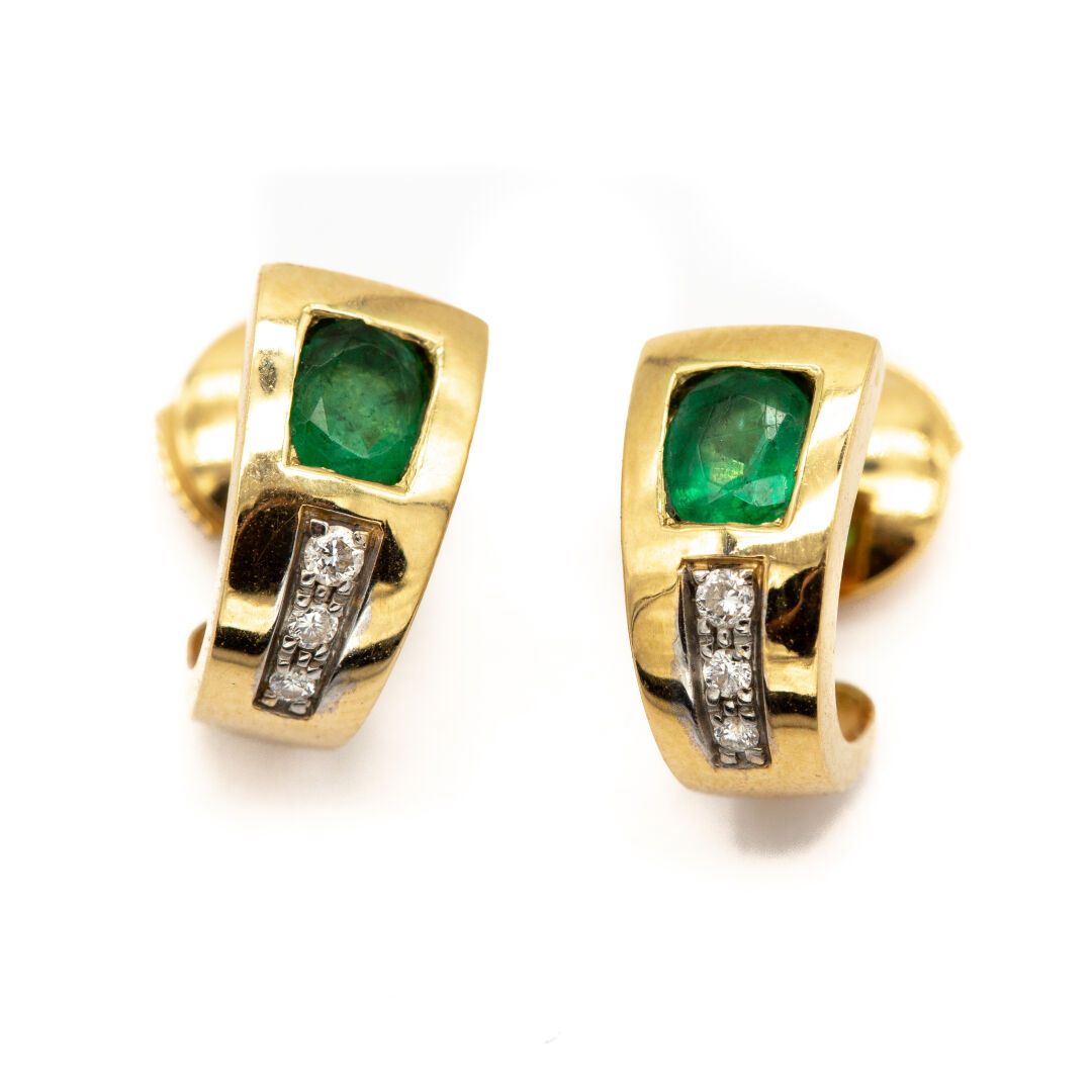 Null Pair of 18K yellow gold half hoop earrings set with an emerald followed by &hellip;