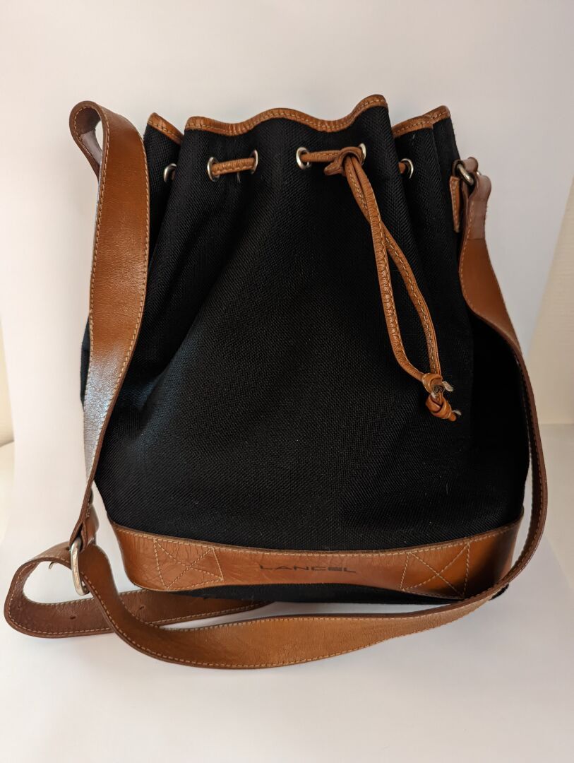 Null LANCEL. Black canvas and brown leather bag. Wear.