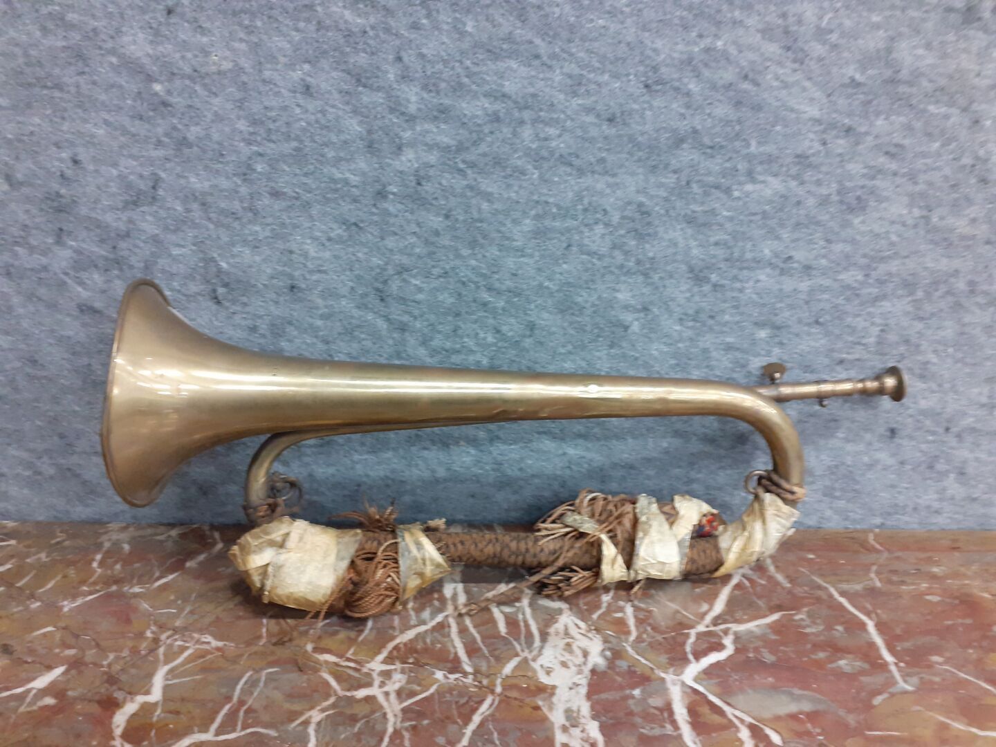 Null A bugle with its cord and still its original Kraft paper, stamp of the 34th&hellip;