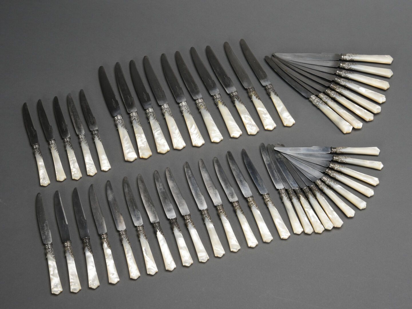 Null A set of eighteen table knives and eighteen dessert knives with mother of p&hellip;