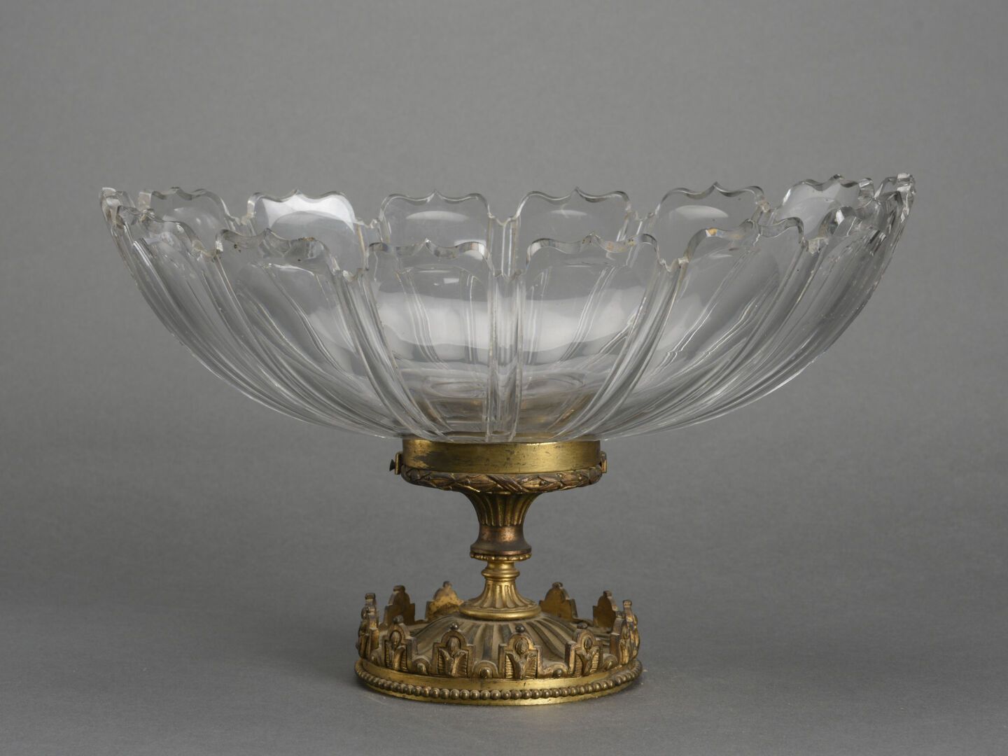 Null Large crystal cup cut with large gadroons it rests on a bronze pedestal
Aro&hellip;