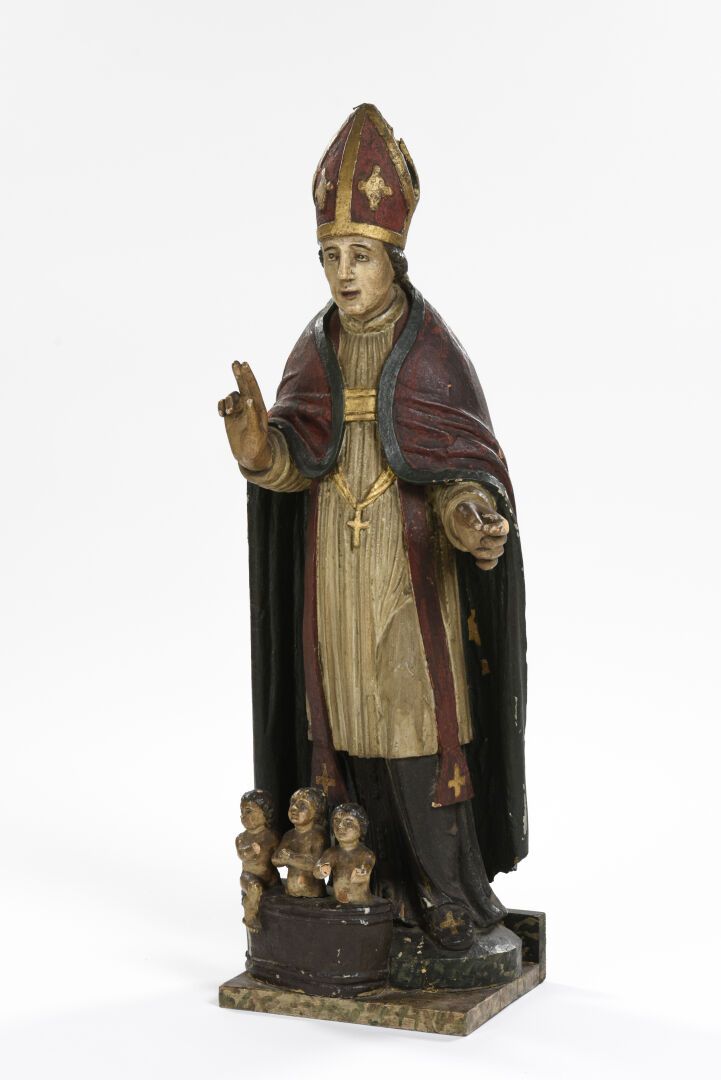 Null 圣尼古拉
多色木雕主题的圣尼古拉站着送孩子。
18世纪
高：95 - 宽：36 - 深：26厘米
(漆面有小缺口，一只手重新雕刻过）。