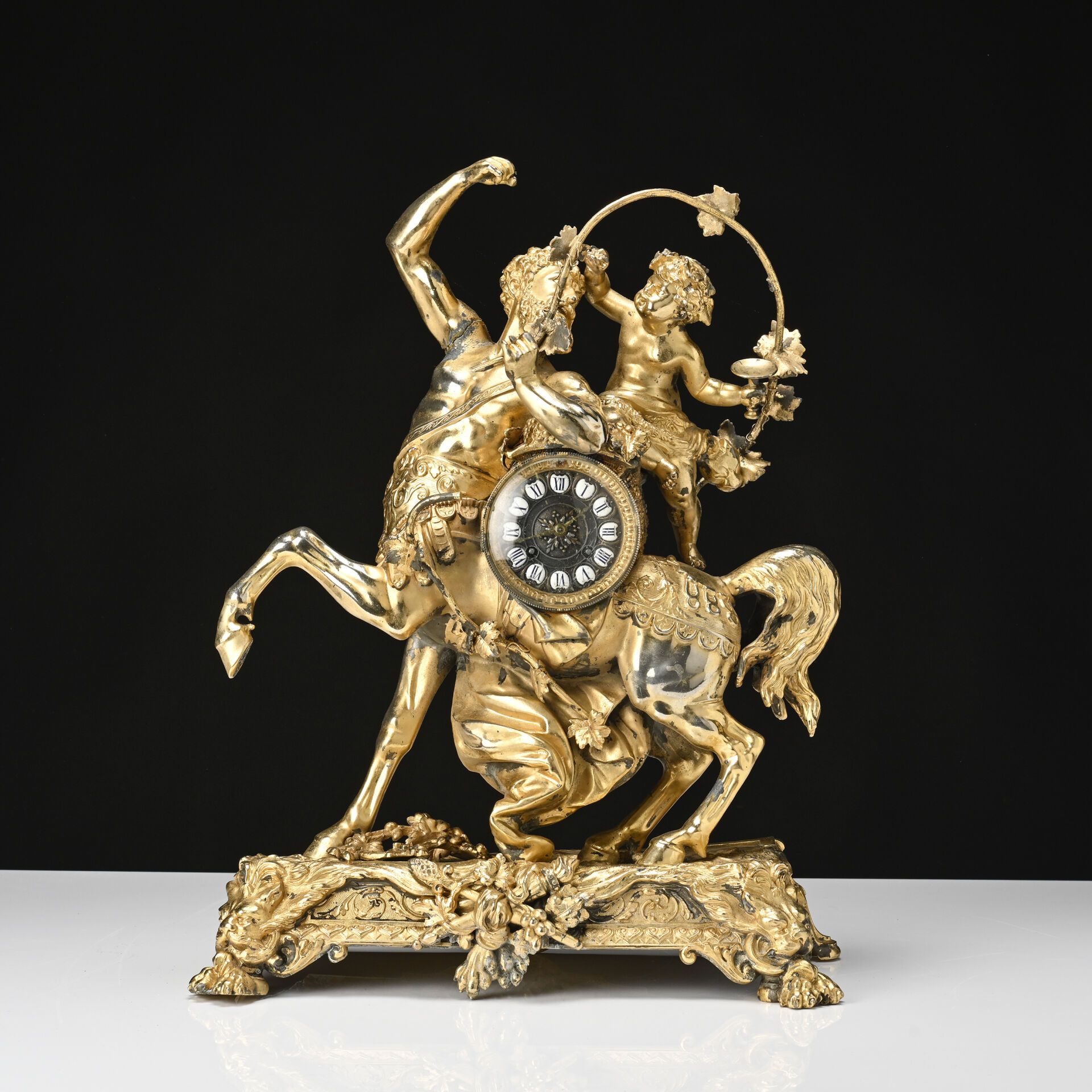 Null Centaur and Bacchus child 
Gilded regule clock 
19th century
H: 80 - W: 42 &hellip;
