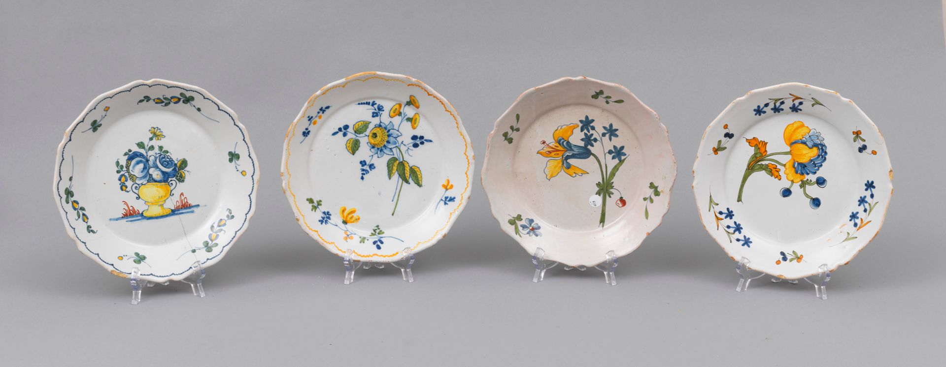 Faience Nevers 
Nevers

Four earthenware plates with contoured edges of flowers &hellip;