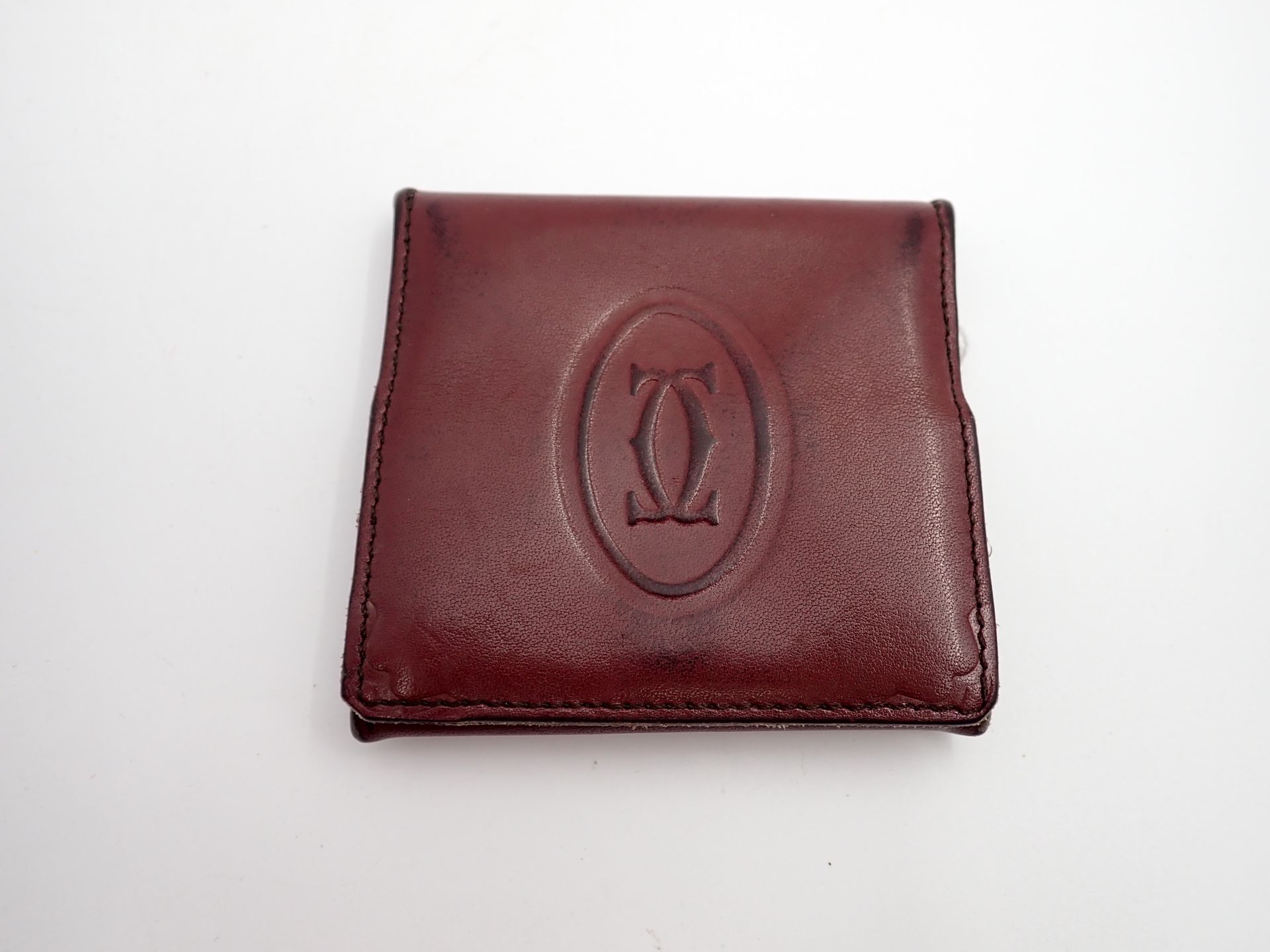 Null CARTIER Bordeaux leather coin purse, 7.5x8 cm
