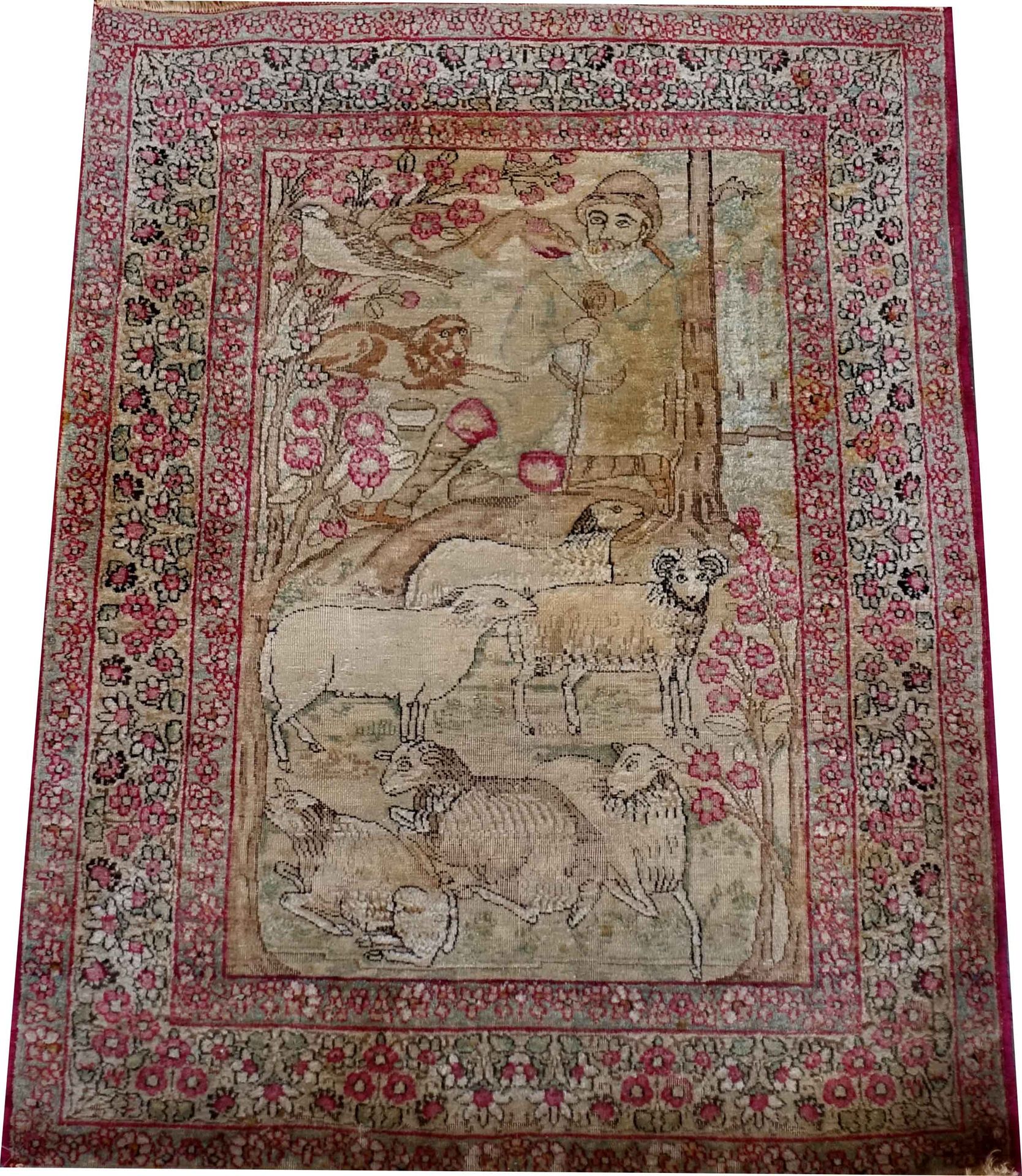 Carpette figurative Kirman. 它展示了一个牧羊人与他的狗和他的羊群。花卉边框有三条带子。尺寸：84 x 60厘米。