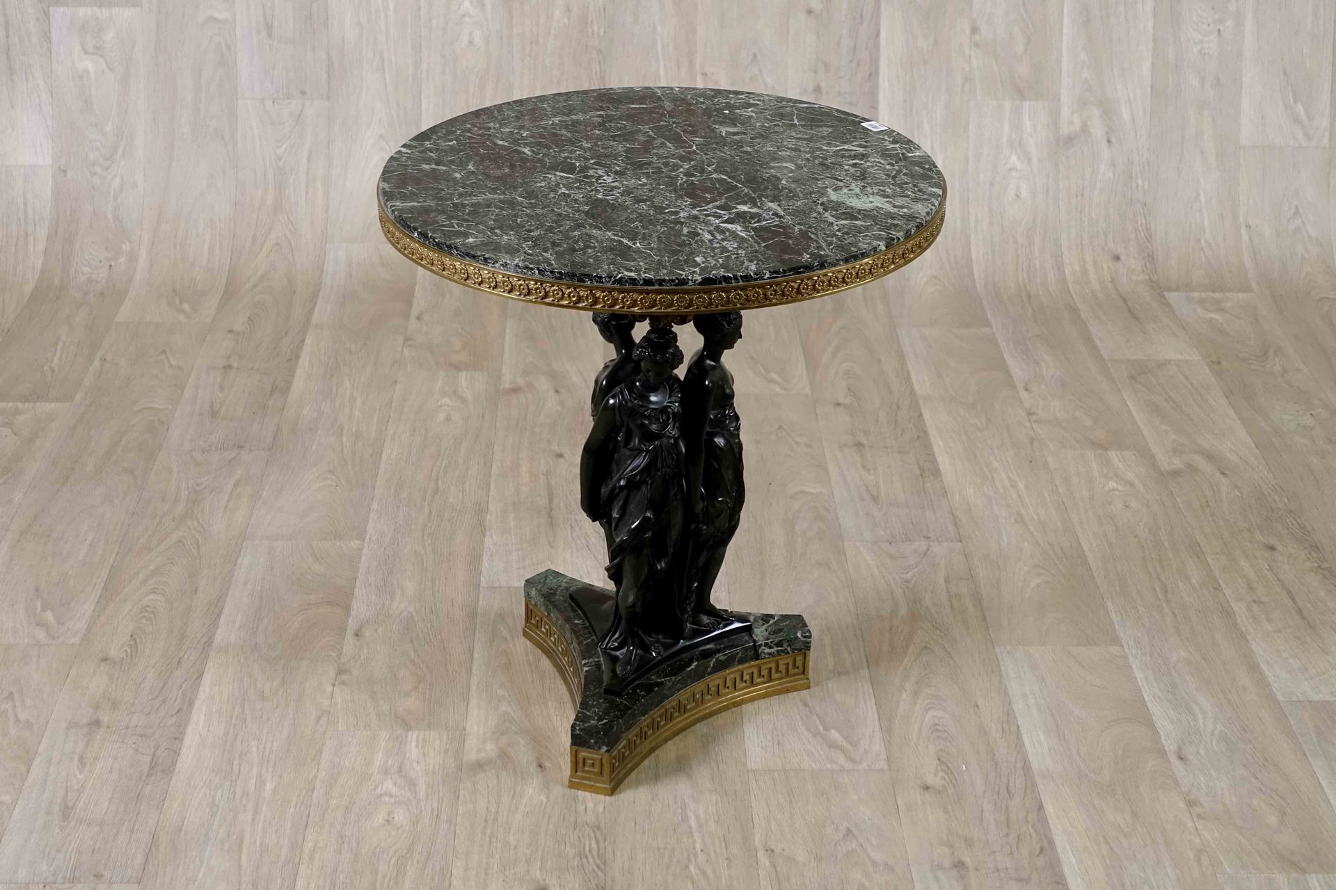 Guéridon. The top of a circular shelf in antique green marble underlined by a fr&hellip;