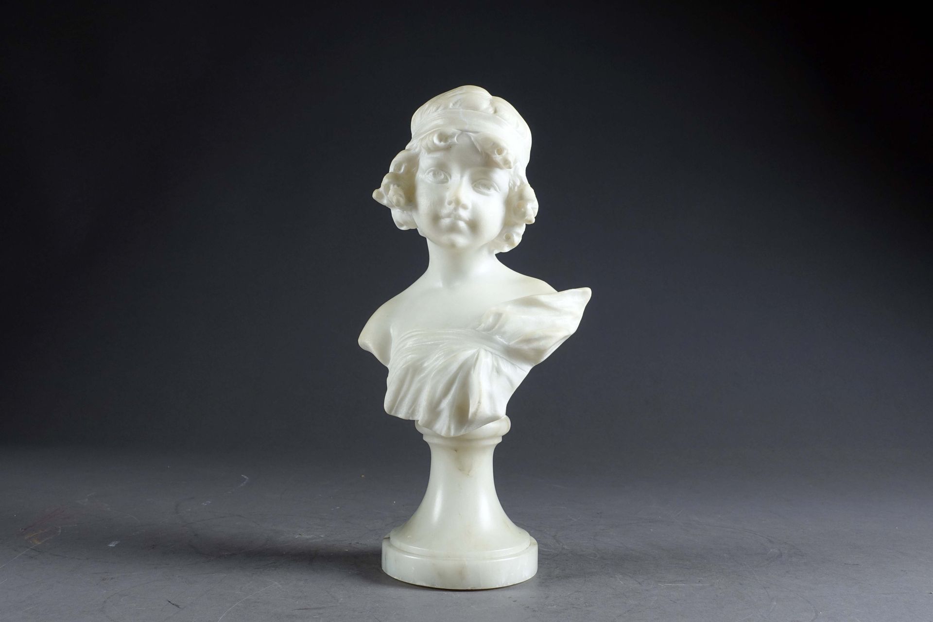 Carli. Bust of a young girl, her hair held back by a headband. Carved alabaster.&hellip;