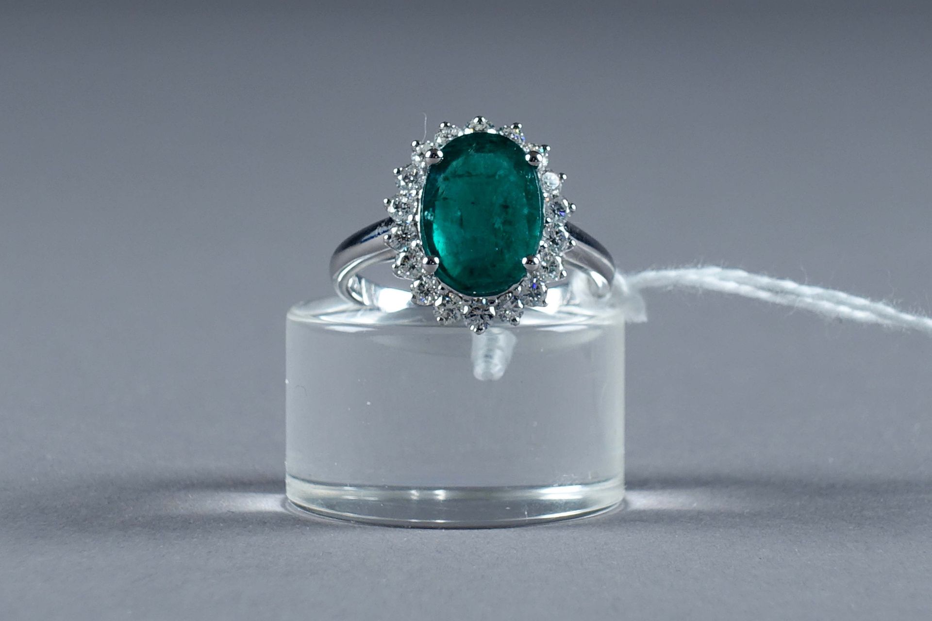 Bague de Dame. Set with an oval emerald (approx. 3 carats 40) set with eighteen &hellip;