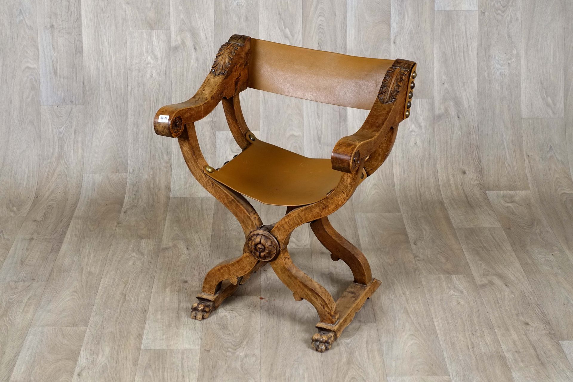 Fauteuil curule dit “Dagobert“. Armrests with scrolls and base crossed by a meda&hellip;