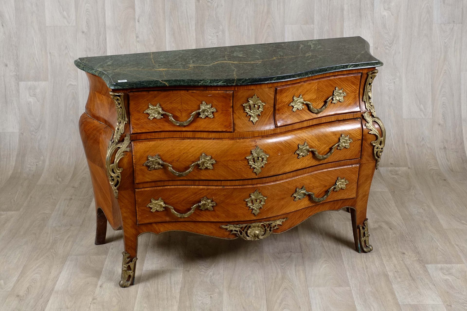 Commode de Style Louis XV. Topped with a green marble. The front, curved, opens &hellip;