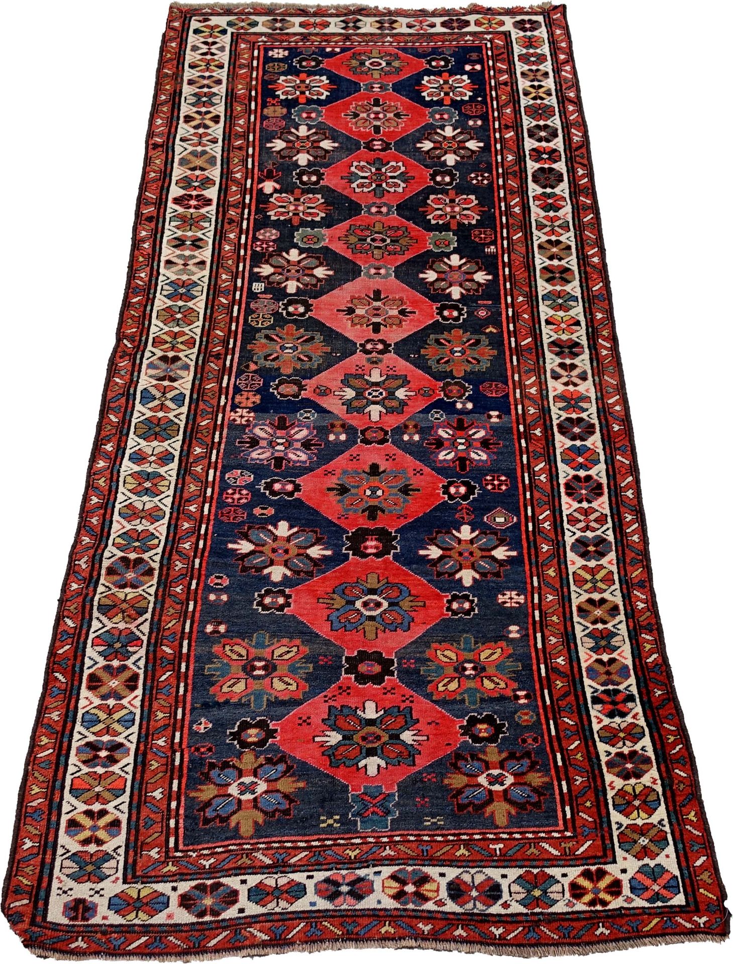 Tapis Caucase-Kazak. Decorated with nine red medallions linked together. Blue ab&hellip;