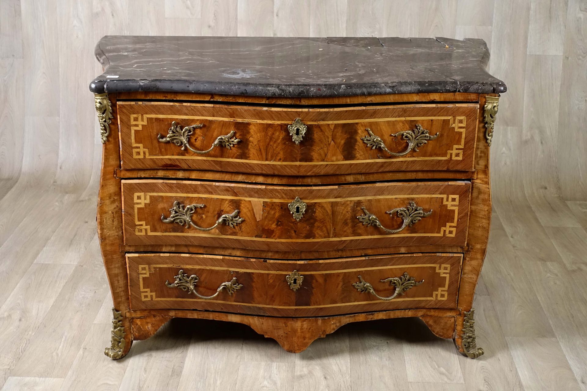 Commode d’époque Louis XV. The top is made of black veined marble. The front is &hellip;