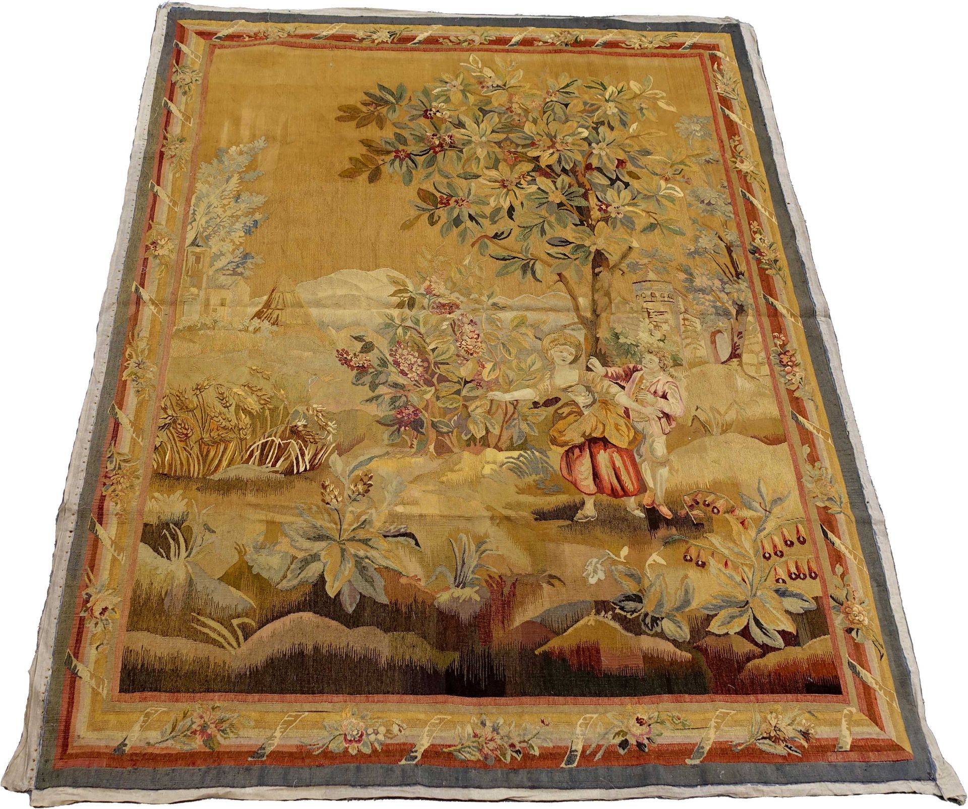 Tapisserie. It figures a couple in a country landscape. Floral border. Work of t&hellip;