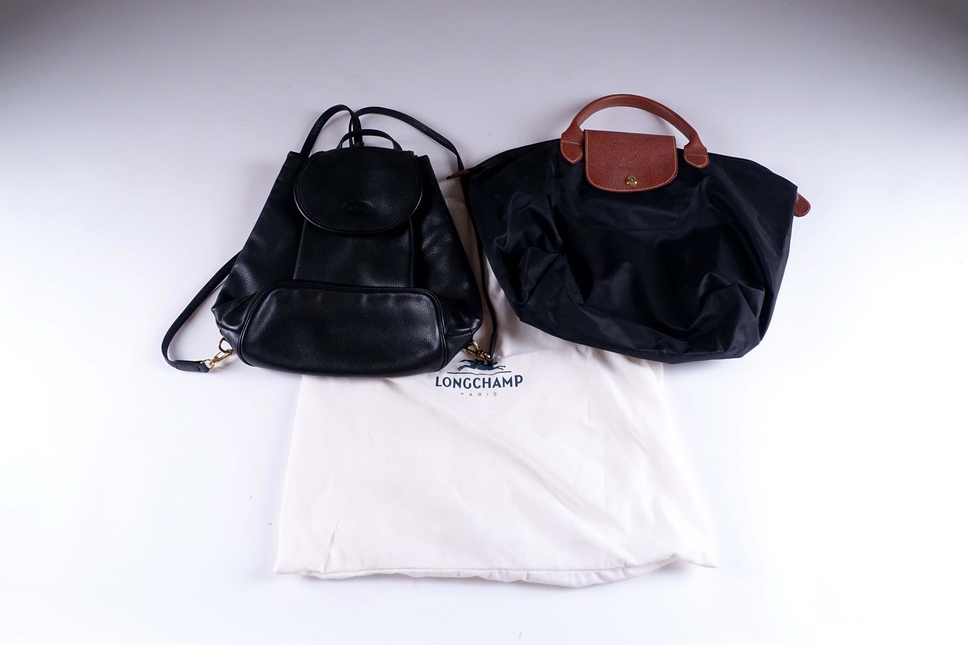 LONGCHAMP. Black leather backpack with gold metal fittings. We join a bag in pla&hellip;