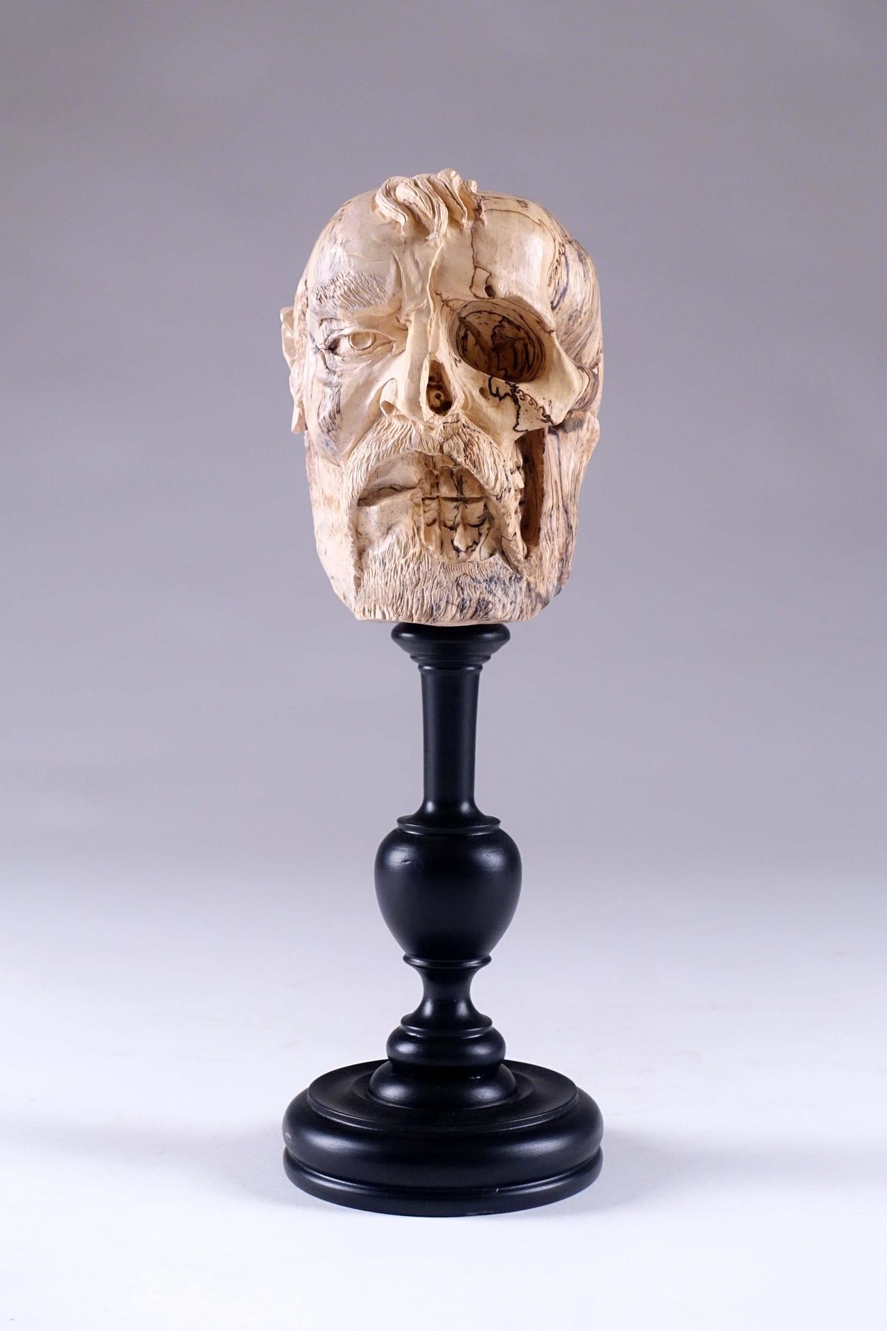 Vanité. Depicting a half emaciated man's head. Carved wood and black lacquered. &hellip;