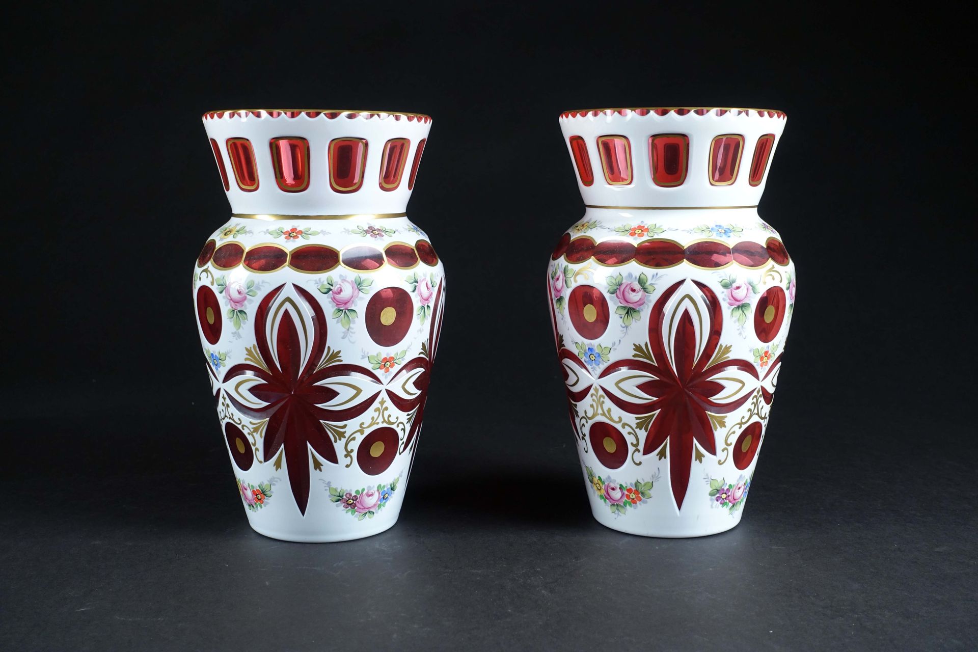 Moser. Pair of tulip-necked vases in red Bohemian crystal with white overlay, en&hellip;