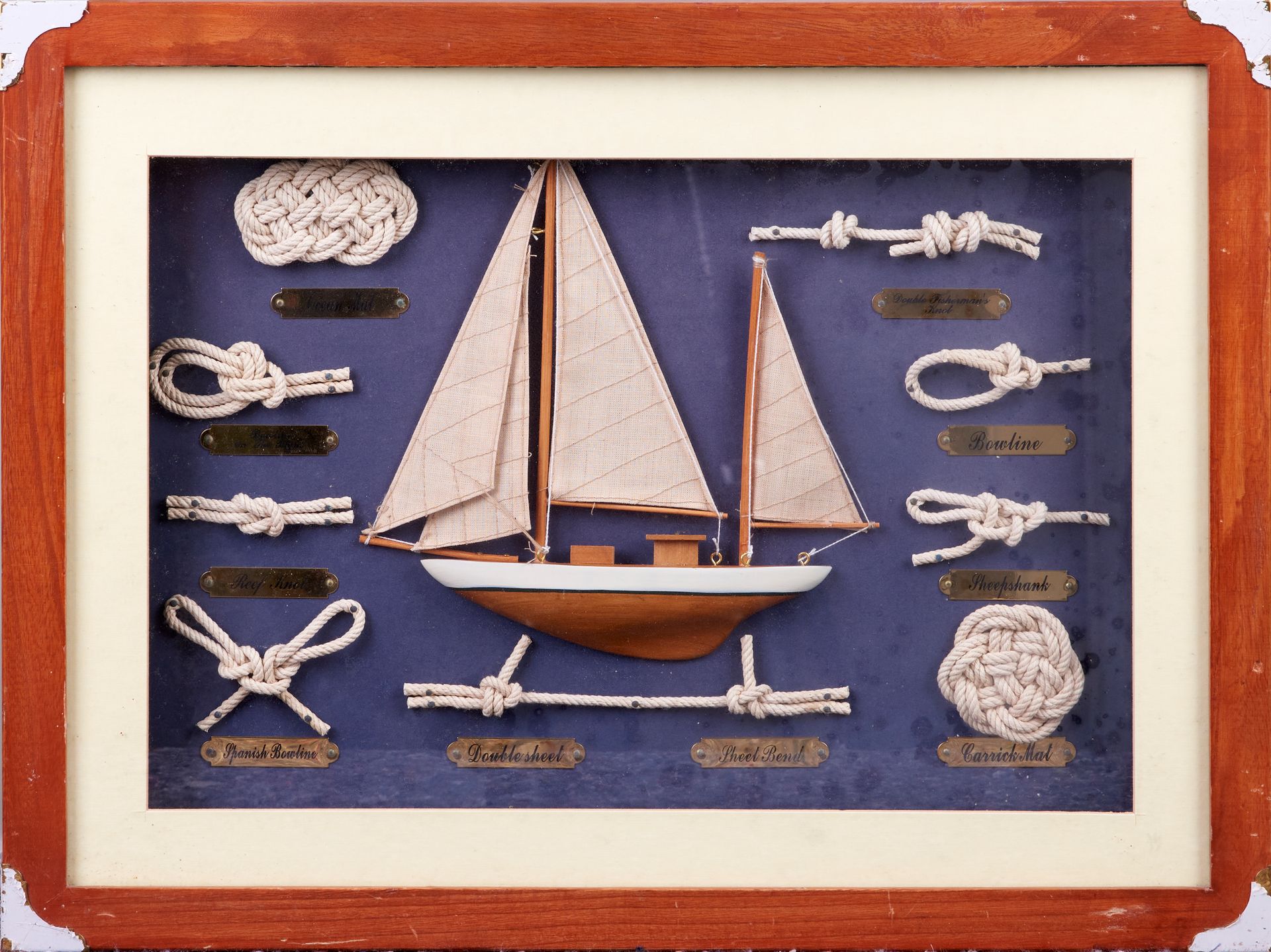 Null Maritime knots, in a frame, under glass