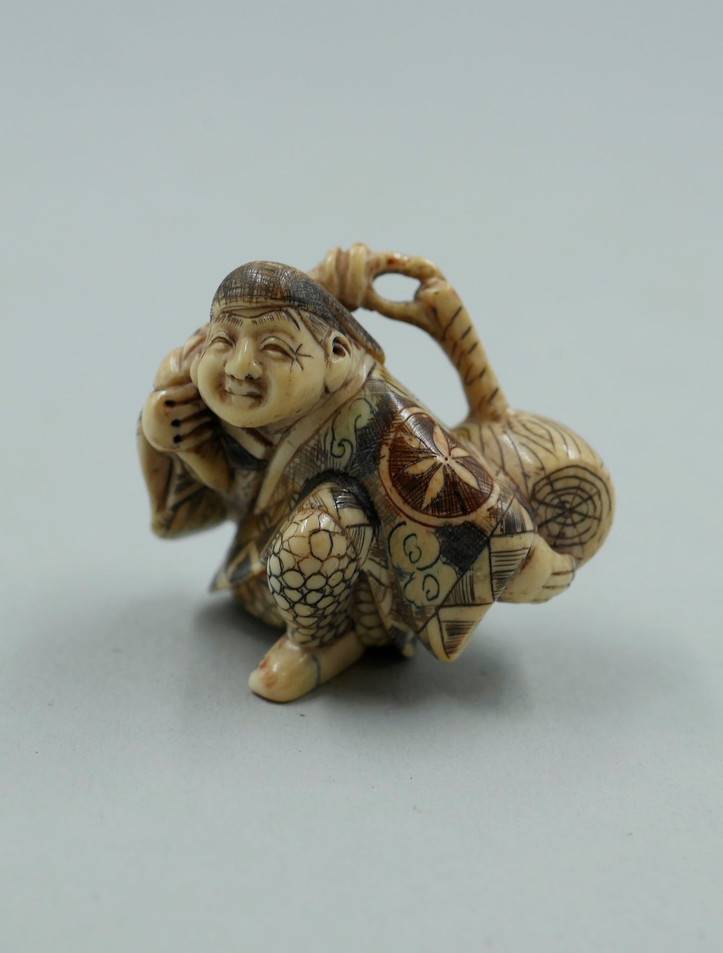 Null Polychrome engraved ivory netsuke, The water carrier. Signed with the stamp&hellip;