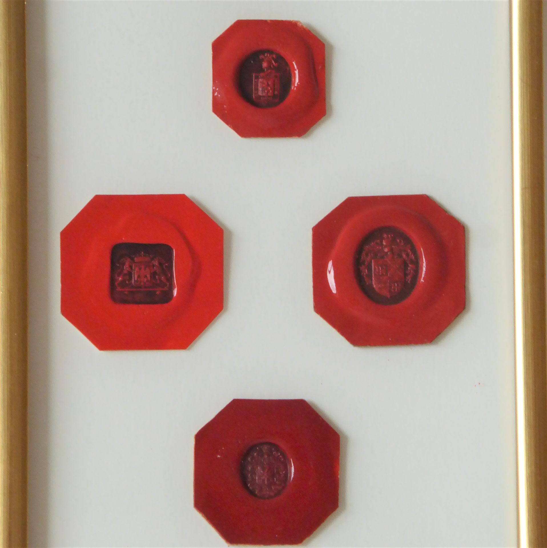 Null Four wax seals, coat of arms of knights. In a frame