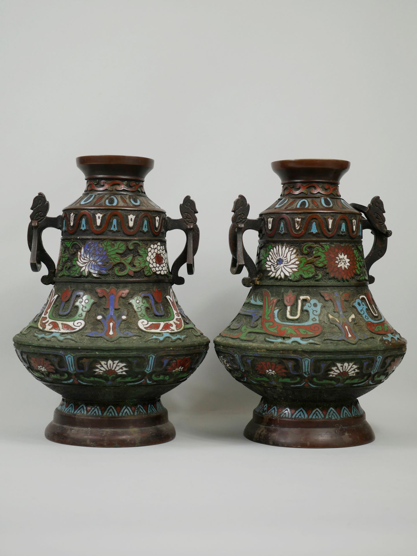 Null CHINA, 20th century. A pair of vases decorated with flowers and archaic mot&hellip;