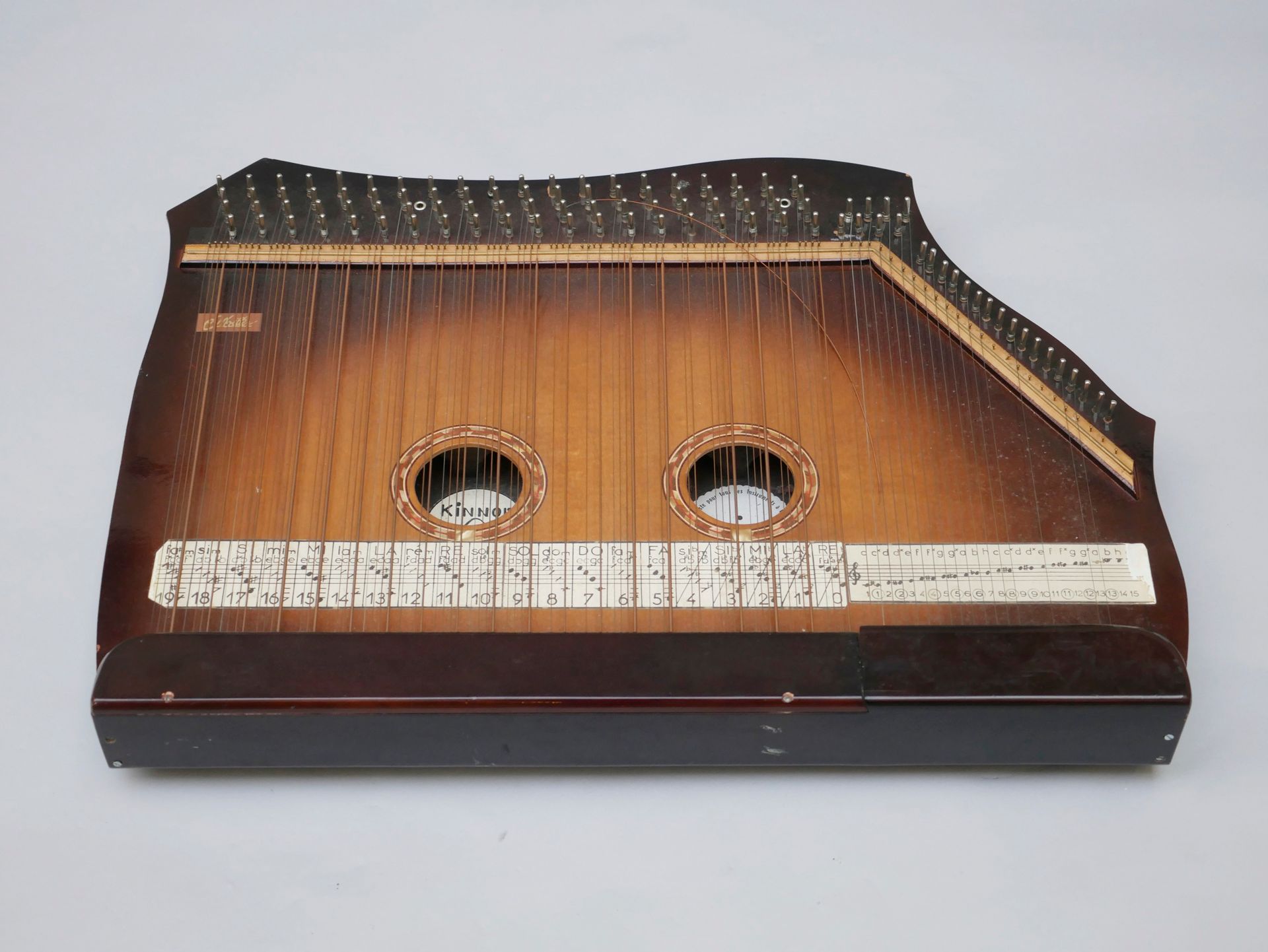 Null Large zither sold by Henry Miller.

Sold as is.