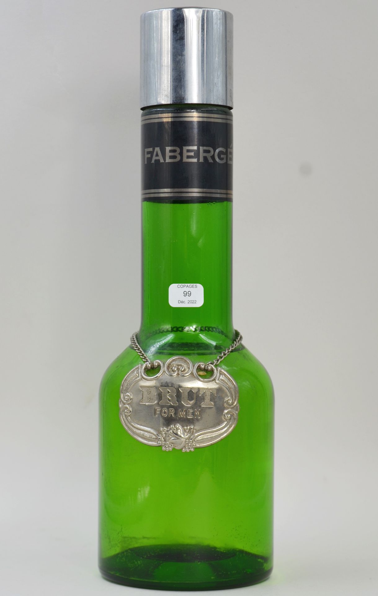 Null FABERGE "Brut" (生)

装饰用的高位假瓶，有色玻璃，颈部有金属，有标题。

高：30厘米